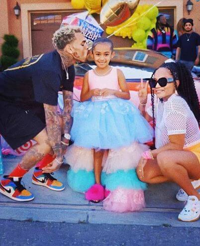 Royalty Brown with her parents on her 6th birthday party.